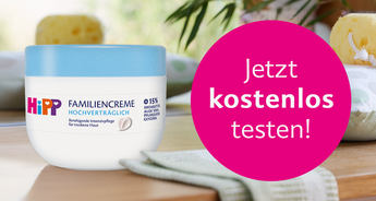 Eine Dose "Hipp Familiencreme" mit einem rosafarbenen Banner mit der Aufschrift "Jetzt kostenlos testen!".
