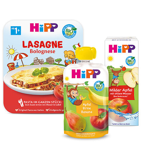 Verschiedene Babynahrungsprodukte der Marke "Hipp", darunter ein Cannelloni-Beutel, ein Beutel mit Bananen- und Apfelpüree und eine Packung mit mildem Apfel- und Bananensaft.