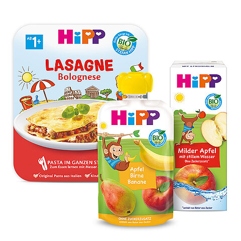 Verschiedene Babynahrungsprodukte der Marke "Hipp", darunter ein Cannelloni-Beutel, ein Beutel mit Bananen- und Apfelpüree und eine Packung mit mildem Apfel- und Bananensaft.