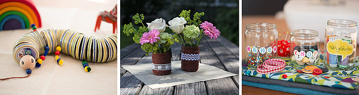 Eine bunte Raupe aus Garn, eine Vase mit frischen Blumen und ein mit bunten Gegenständen gefülltes Gefäß.