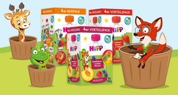 Eine Reihe von 'HiPPis'-Fruchtbeuteln mit verschiedenen Fruchtgeschmacksrichtungen, begleitet von animierten Figuren einer Giraffe, eines Frosches und eines Fuchses.